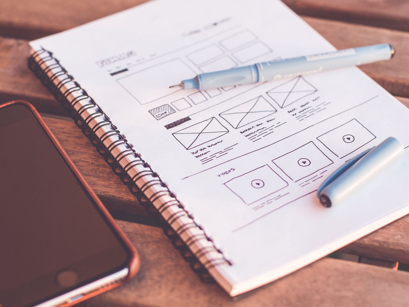 UI/UX designer reviewing interface wireframes and layouts