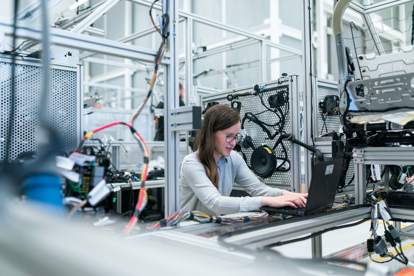 Manufacturing facility with engineers monitoring production systems